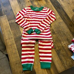 Hannah Anderson, red and white striped Christmas pajama set US size 6–7.